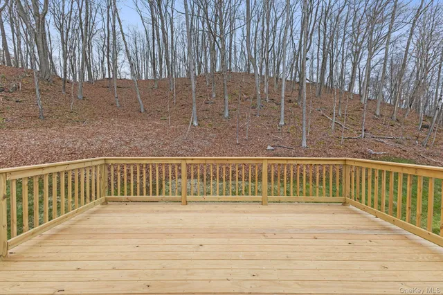 a view of balcony with wooden floor