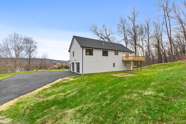 a view of a house with a yard porch and sitting area