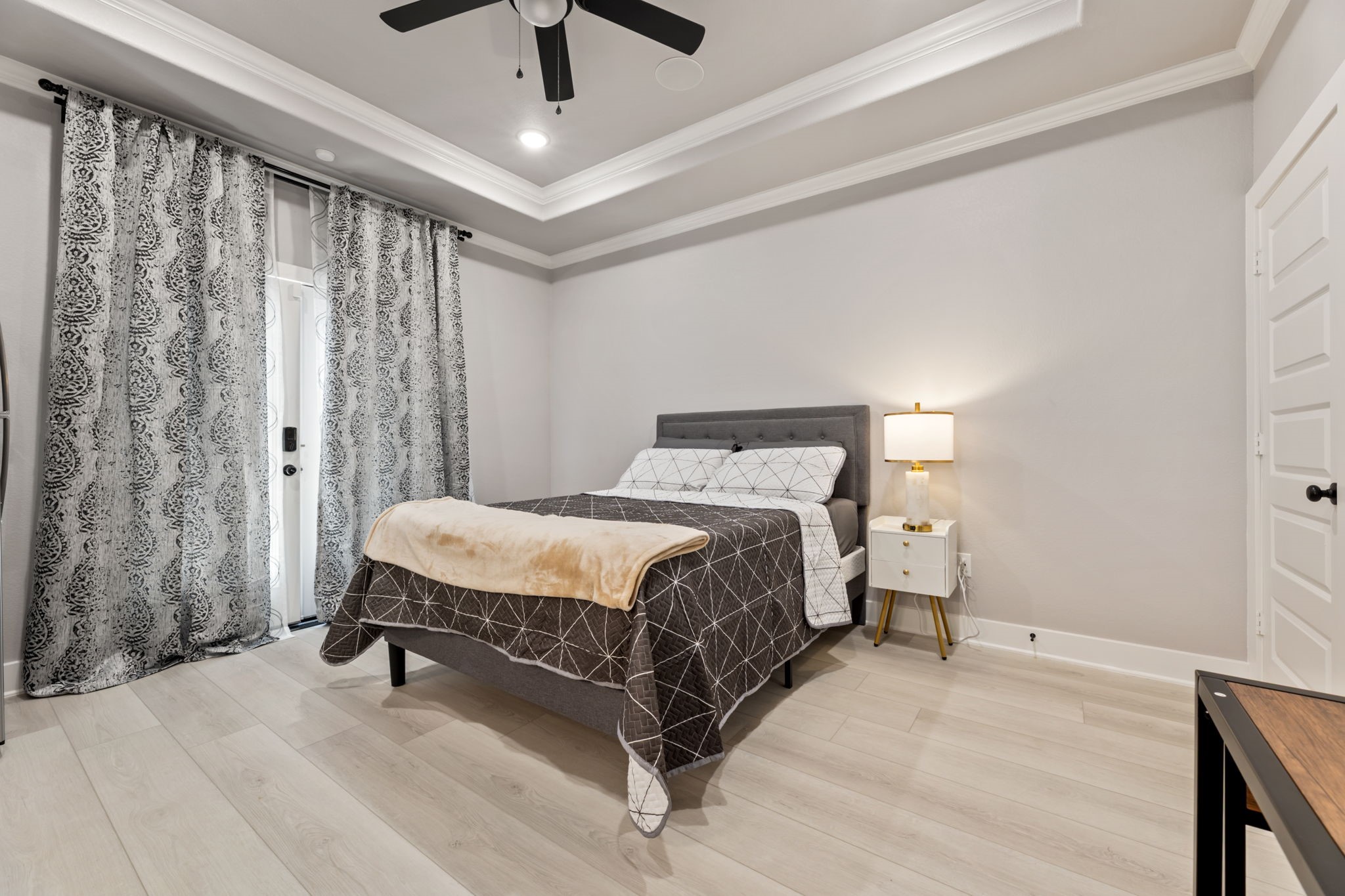 8521 Brandon Street, Unit STUDIO Houston, TX 77051 - Photo 3 of 14 a bed sitting in a spacious bedroom next to a window