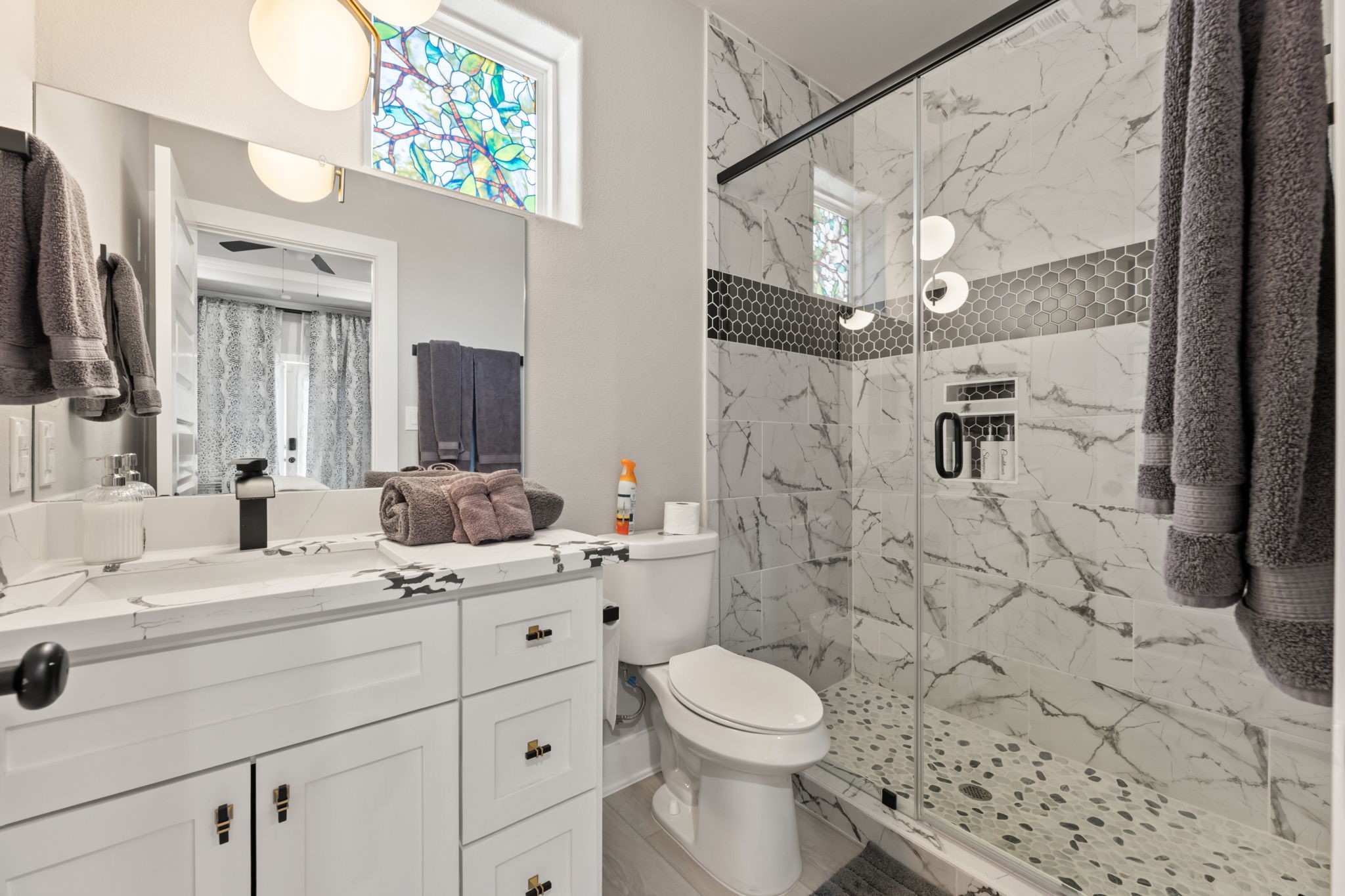 8521 Brandon Street, Unit STUDIO Houston, TX 77051 - Photo 6 of 14 a bathroom with a sink a toilet and shower