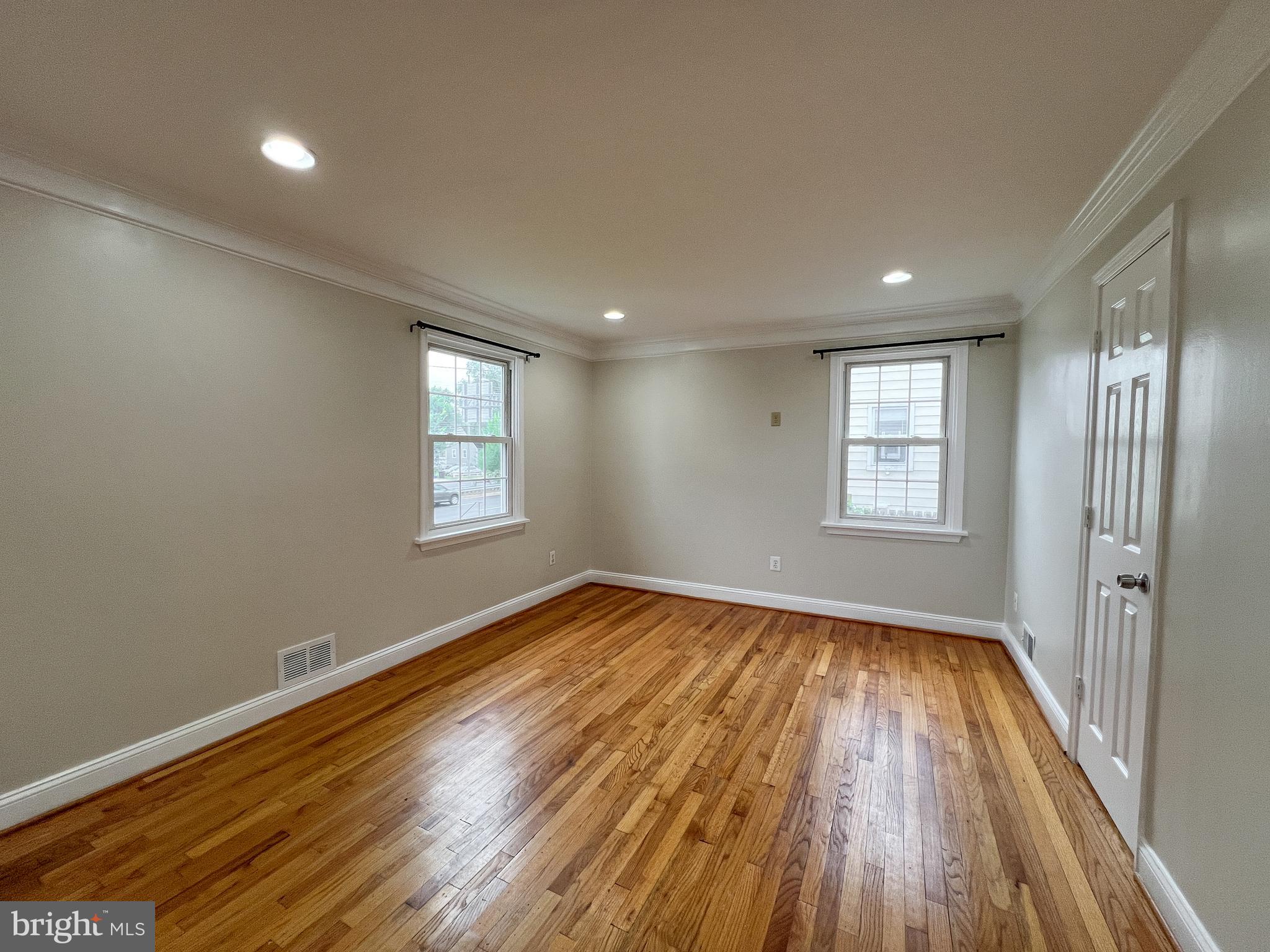 2515 Randolph Road Silver Spring, MD 20902 - Photo 11 of 36 wooden floor in an empty room with a window