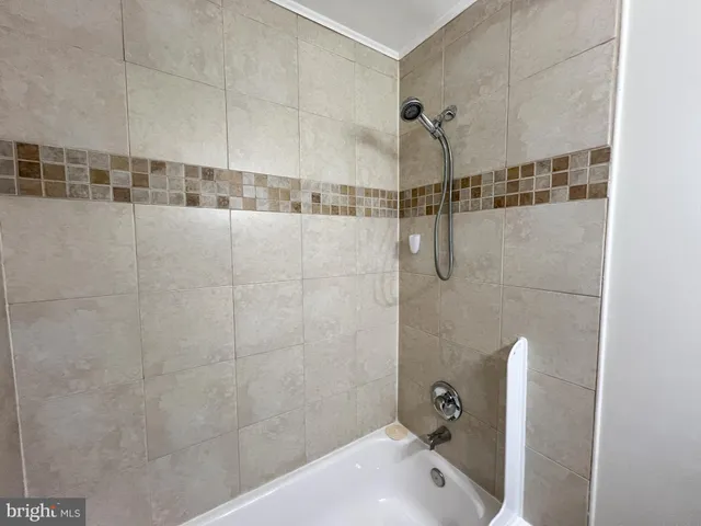 a bathroom with a shower and a shower