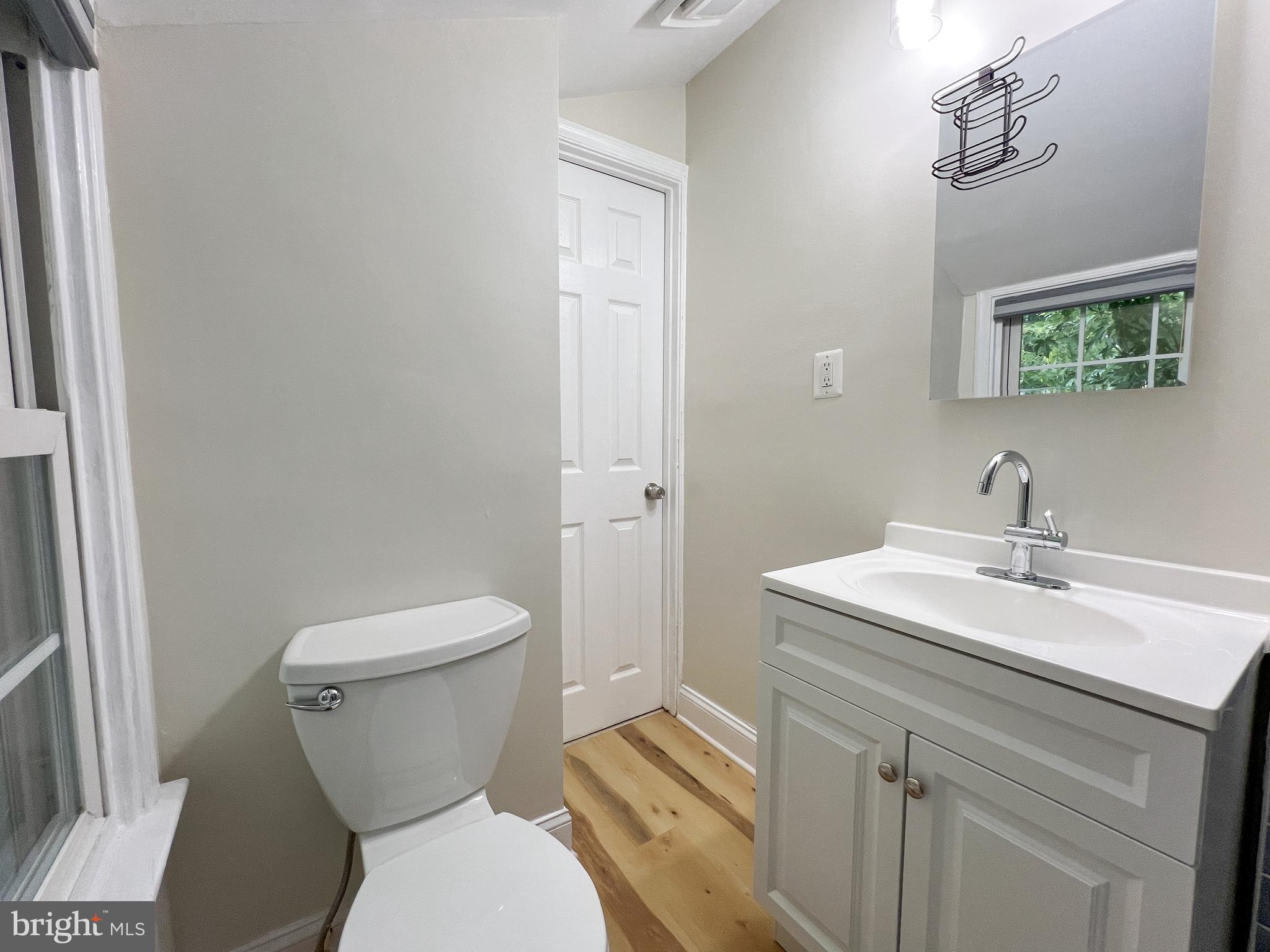 2515 Randolph Road Silver Spring, MD 20902 - Photo 24 of 36 a bathroom with a toilet a sink and mirror