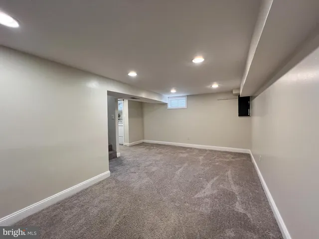 an empty room with a empty space and windows