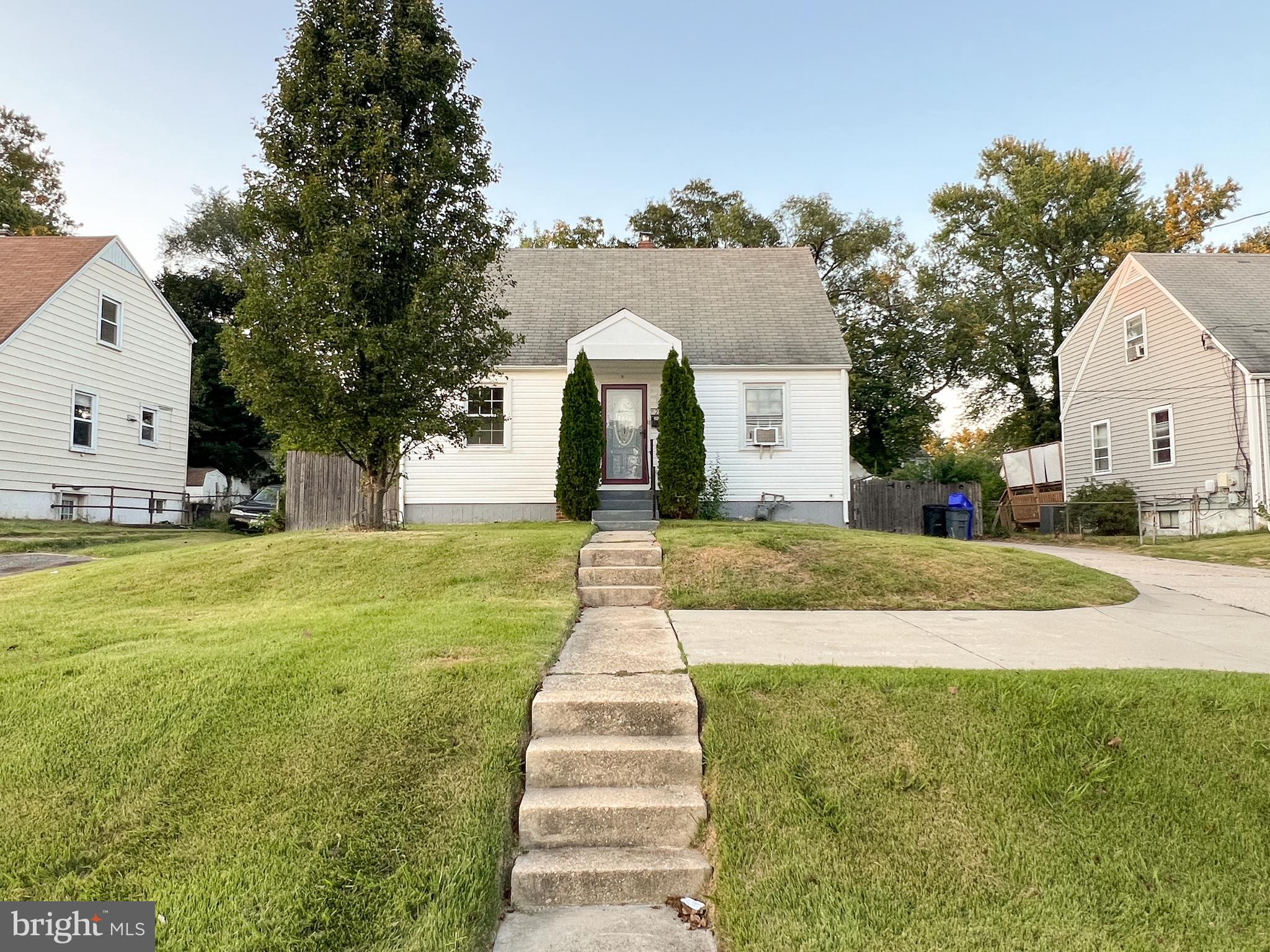 2515 Randolph Road Silver Spring, MD 20902 - Photo 3 of 36 a front view of a house with a yard and trees