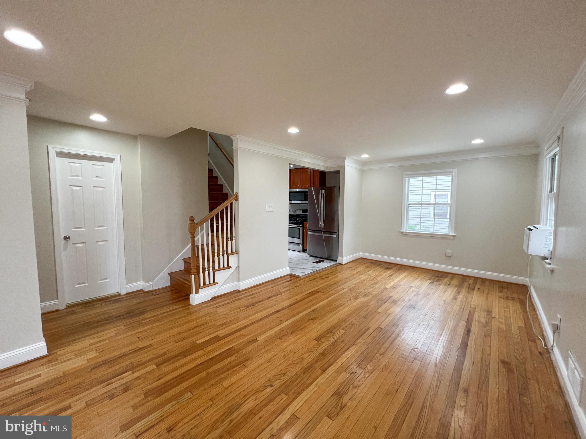 2515 Randolph Road Silver Spring, MD 20902 - Photo 7 of 36 a view of empty room with wooden floor and window