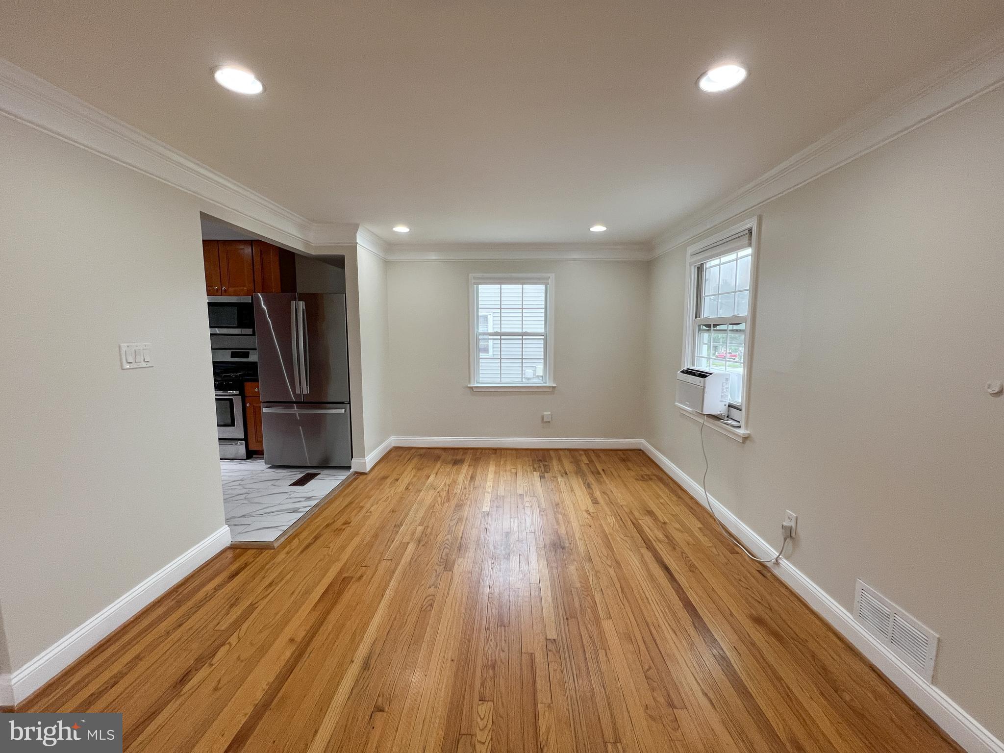 2515 Randolph Road Silver Spring, MD 20902 - Photo 8 of 36 wooden floor in an empty room with a window
