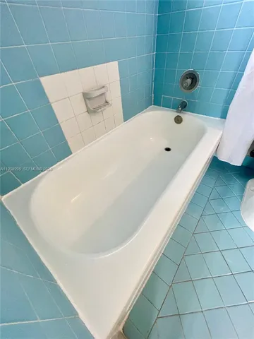 a bathroom with a sink mirror vanity and toilet