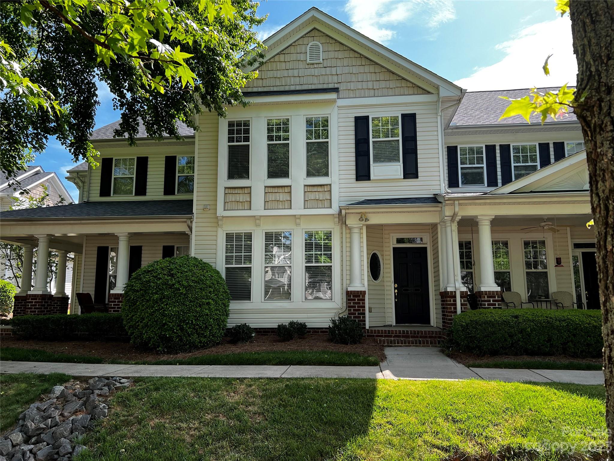 2048 Gable Way Lane Matthews, NC 28104 - Photo 1 of 16 a front view of a house with a yard