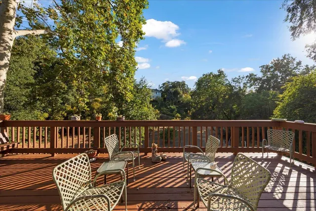 a view of a patio with wooden floor