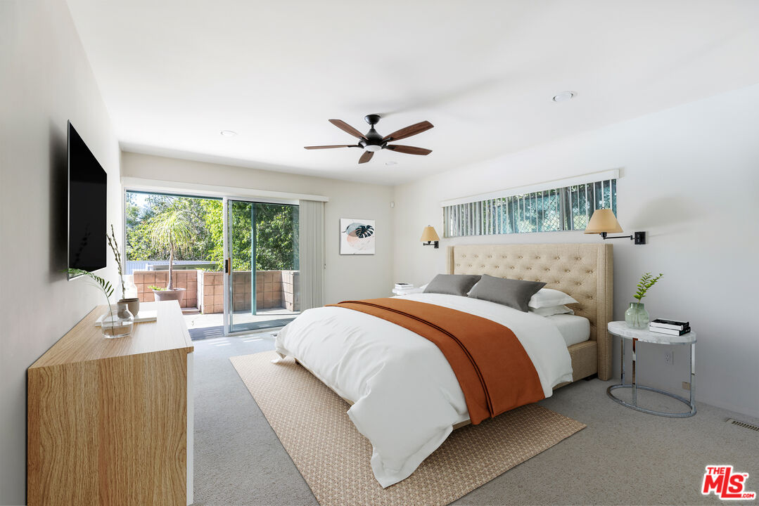 2860 Roscomare Road Los Angeles, CA 90077 - Photo 8 of 15 a bed room with a bed and a large window
