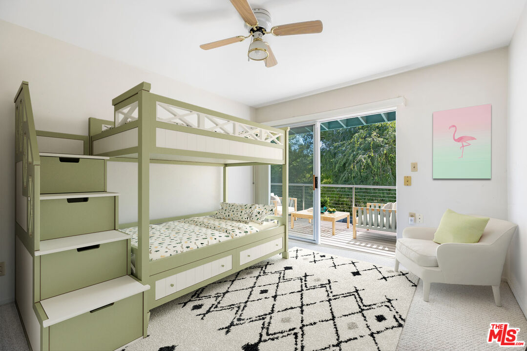 2860 Roscomare Road Los Angeles, CA 90077 - Photo 10 of 15 a bedroom with furniture and a large window