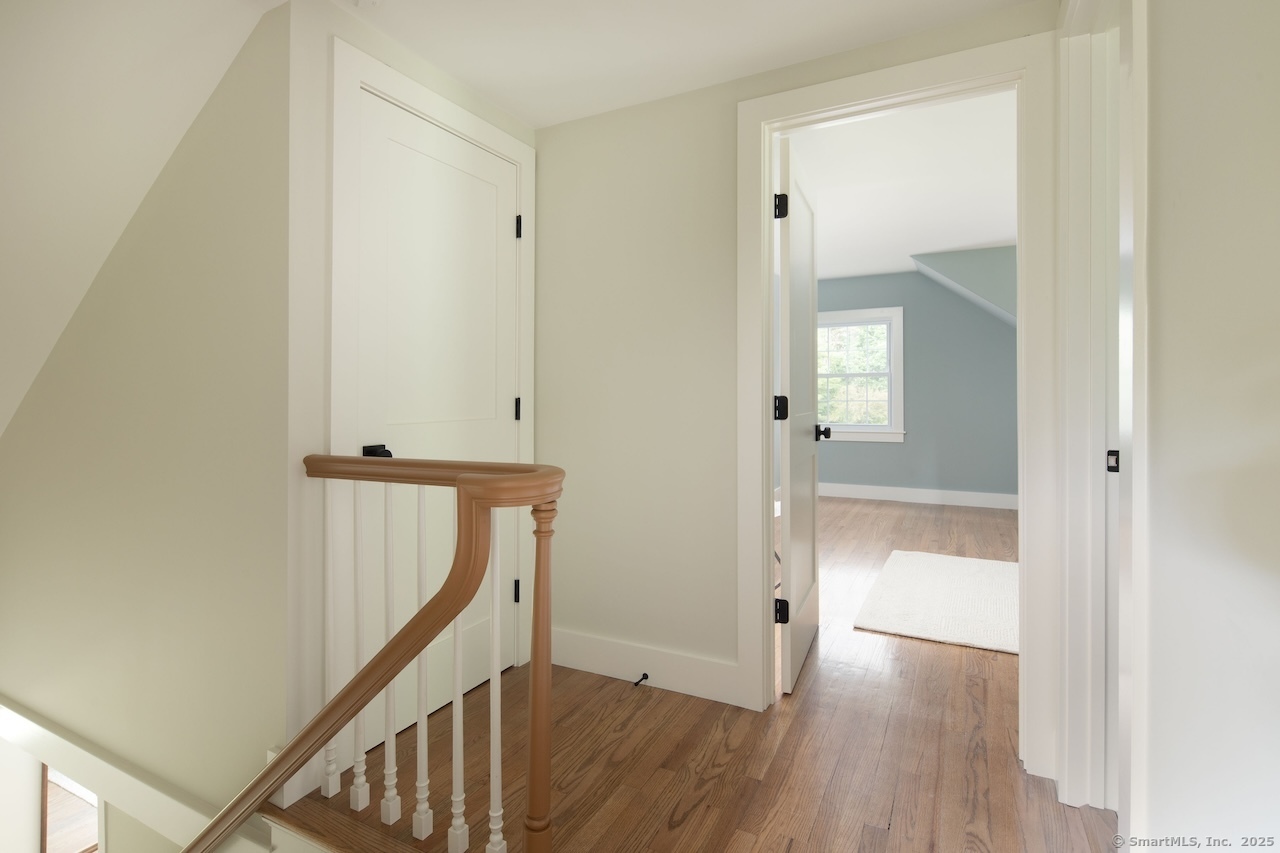 331 Calkinstown Road Sharon, CT 06069 - Photo 11 of 31 a view of a hallway with wooden floor and entryway