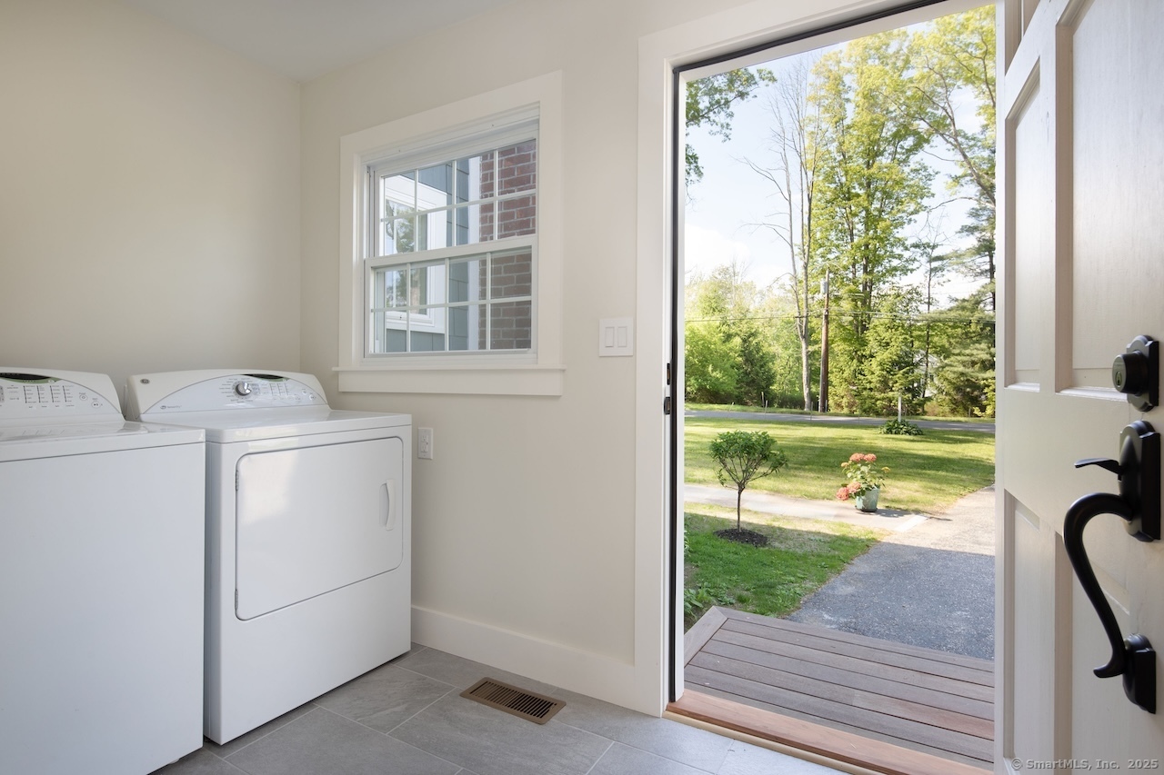 331 Calkinstown Road Sharon, CT 06069 - Photo 15 of 31 a view of a room with washer and dryer sitting next to a window