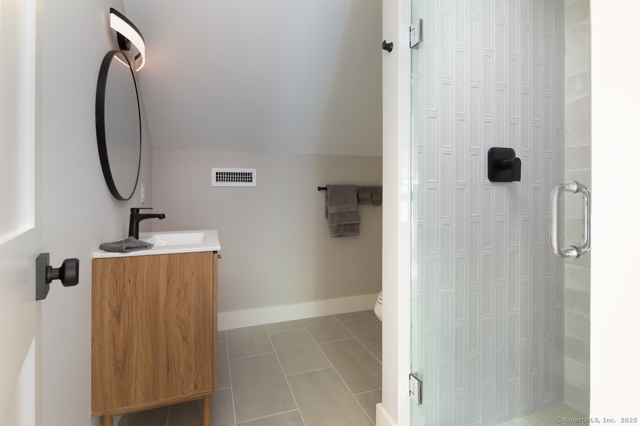 331 Calkinstown Road Sharon, CT 06069 - Photo 17 of 31 a bathroom with a sink and mirror