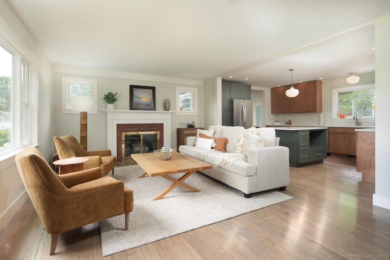 331 Calkinstown Road Sharon, CT 06069 - Photo 2 of 31 a living room with furniture a fireplace and a large window