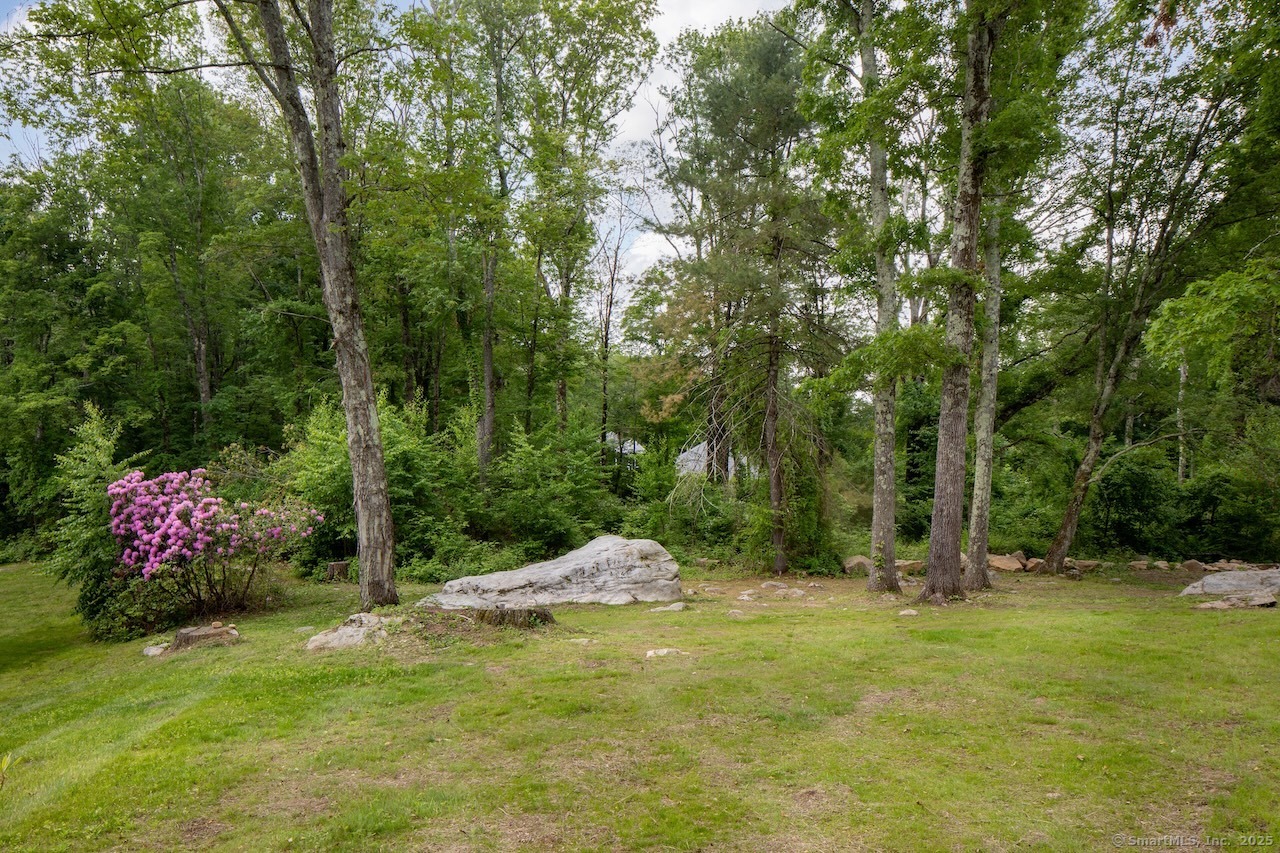 331 Calkinstown Road Sharon, CT 06069 - Photo 21 of 31 a backyard of a house with lots of green space and fountain