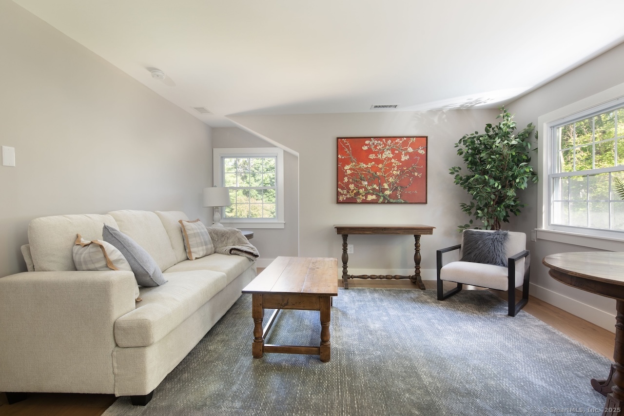 331 Calkinstown Road Sharon, CT 06069 - Photo 25 of 31 a living room with furniture and a large window