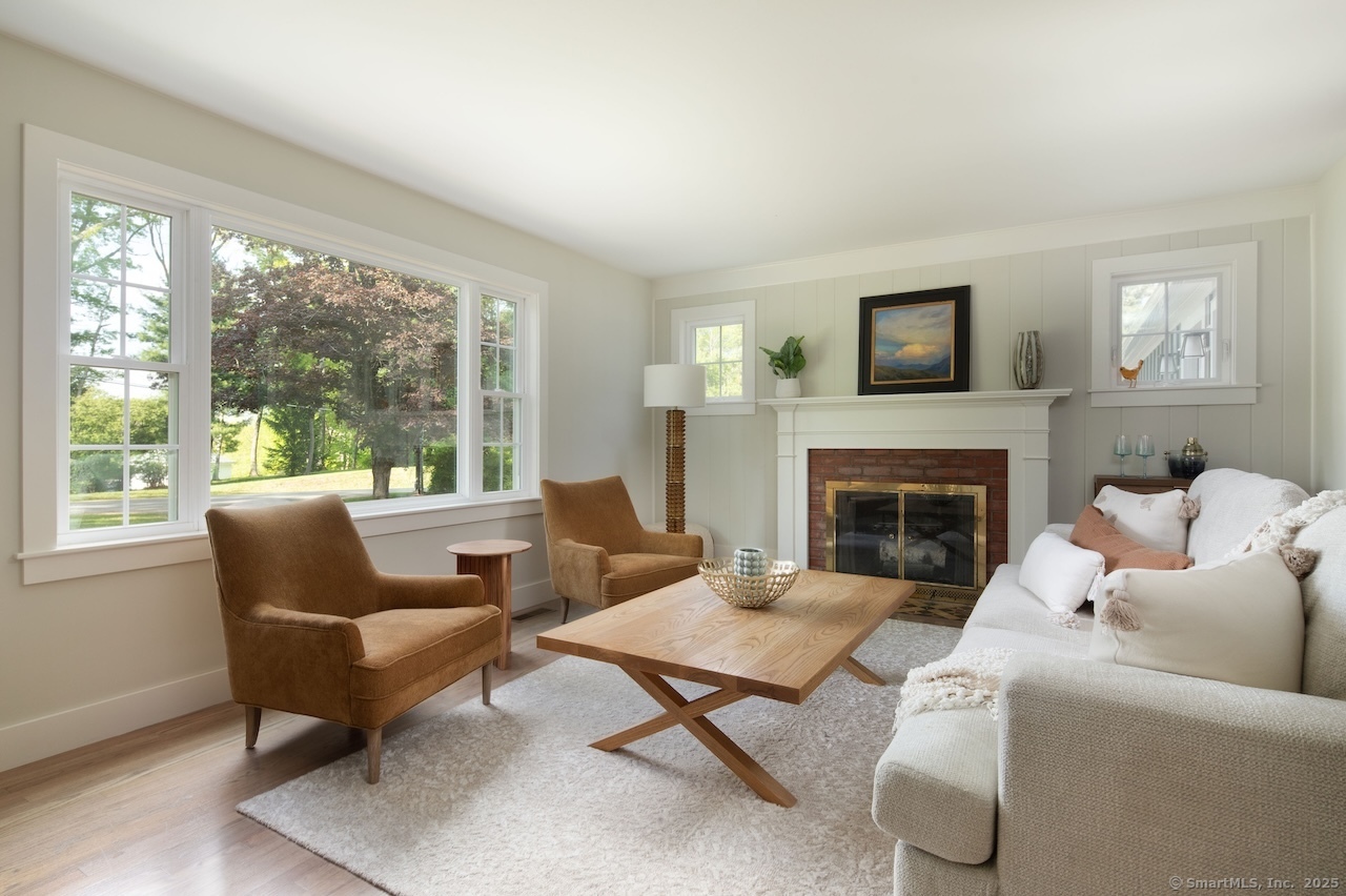 331 Calkinstown Road Sharon, CT 06069 - Photo 28 of 31 a living room with furniture fireplace and a large window