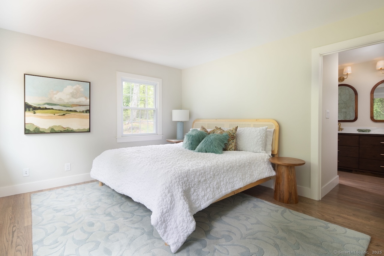 331 Calkinstown Road Sharon, CT 06069 - Photo 5 of 31 a bedroom with a bed and a painting on the wall