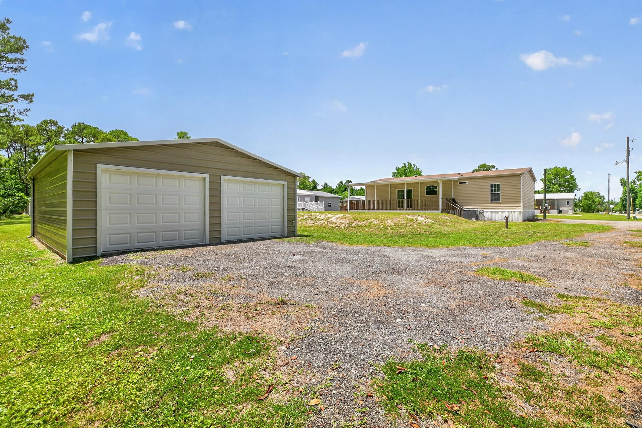 101 Trout Trail Crescent City, FL 32112 - Photo 24 of 45 a front view of a house with a yard and garage