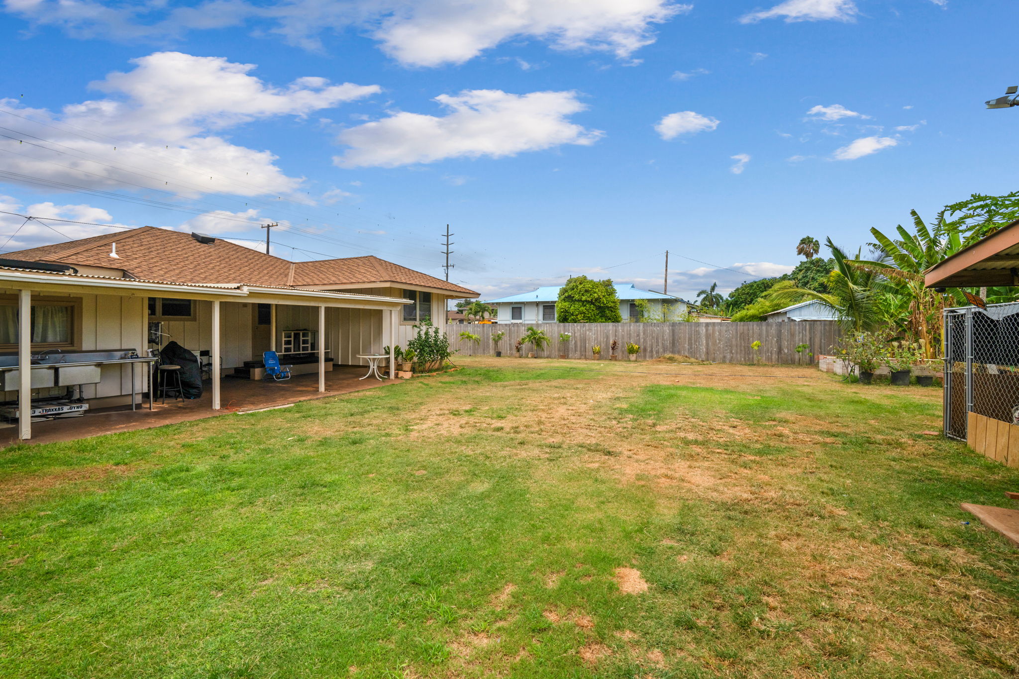 8456 Elepaio Road Kekaha, HI 96752 - Photo 16 of 21 a view of a house with a backyard