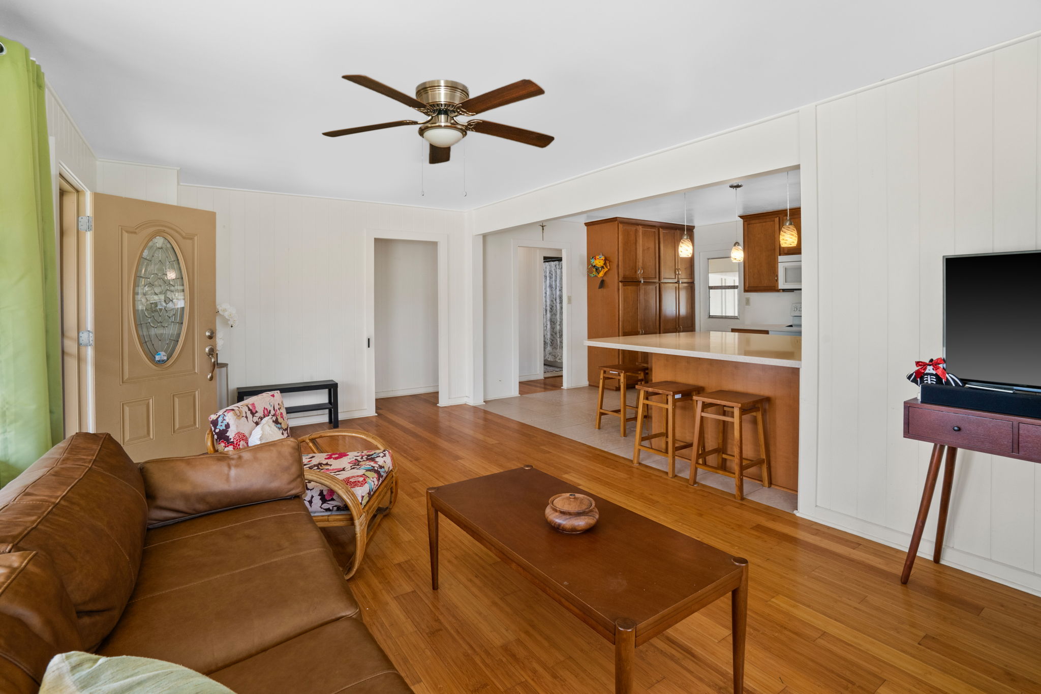 8456 Elepaio Road Kekaha, HI 96752 - Photo 9 of 21 a bed room with a bed furniture and a flat tv screen