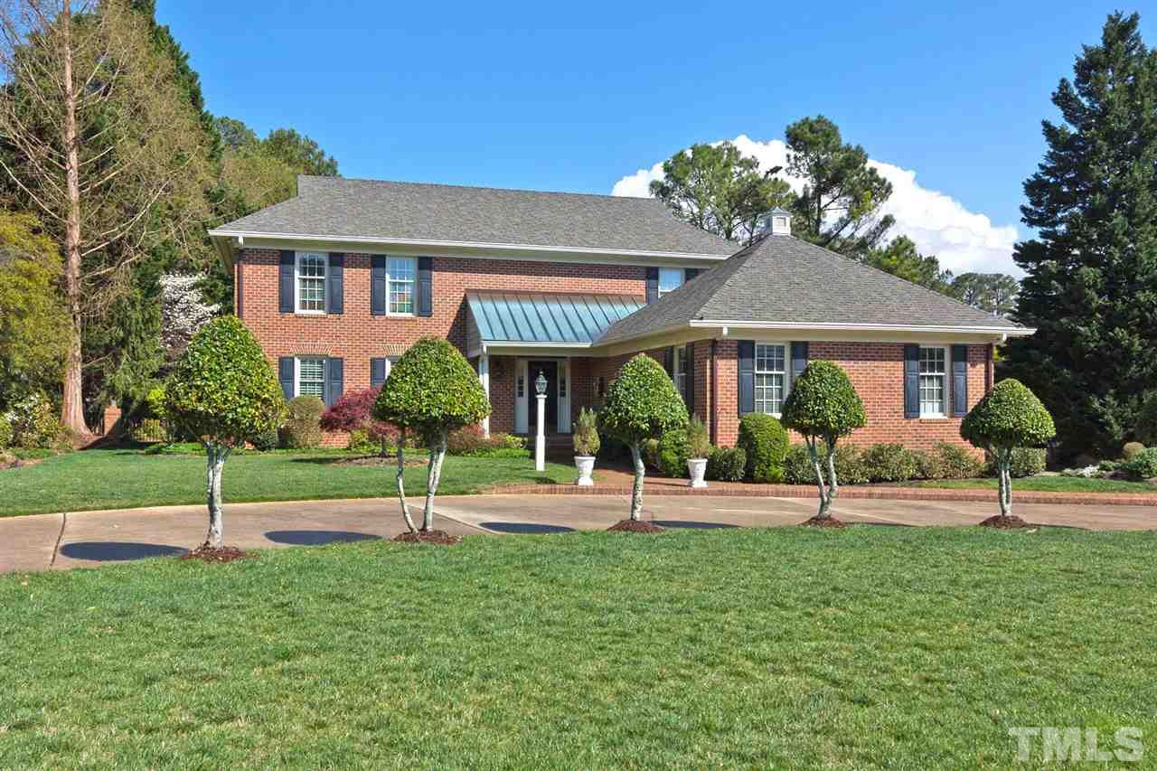 4012 John S Raboteau Wynd Raleigh, NC 27612 - Photo 1 of 25 a house view with a garden space and backyard