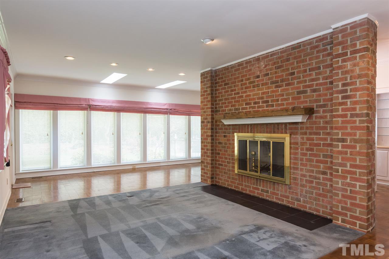 4012 John S Raboteau Wynd Raleigh, NC 27612 - Photo 13 of 25 a view of an empty room with a fireplace
