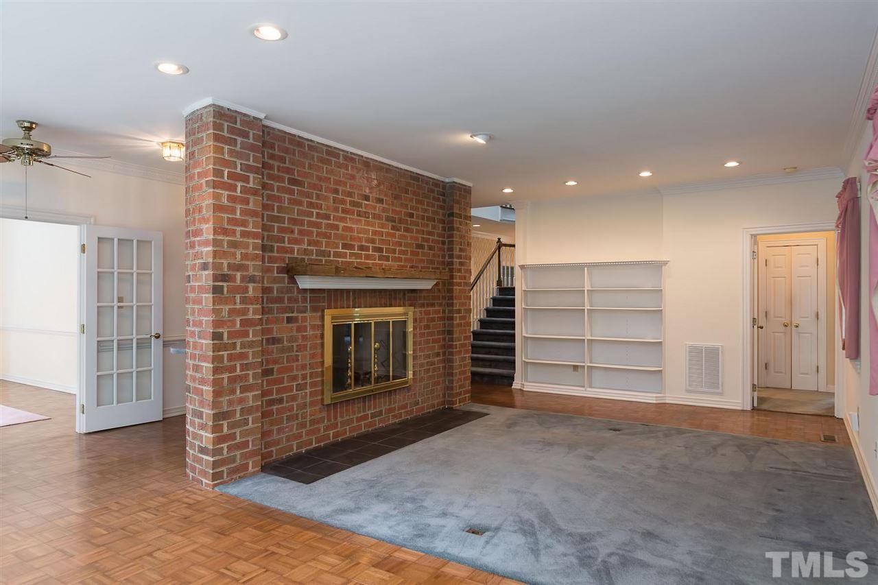 4012 John S Raboteau Wynd Raleigh, NC 27612 - Photo 15 of 25 a view of an empty room with a fireplace