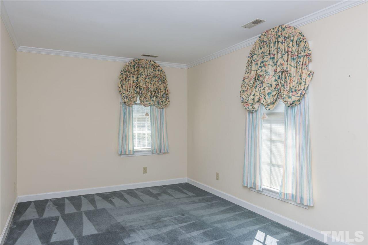 4012 John S Raboteau Wynd Raleigh, NC 27612 - Photo 20 of 25 an empty room with a window
