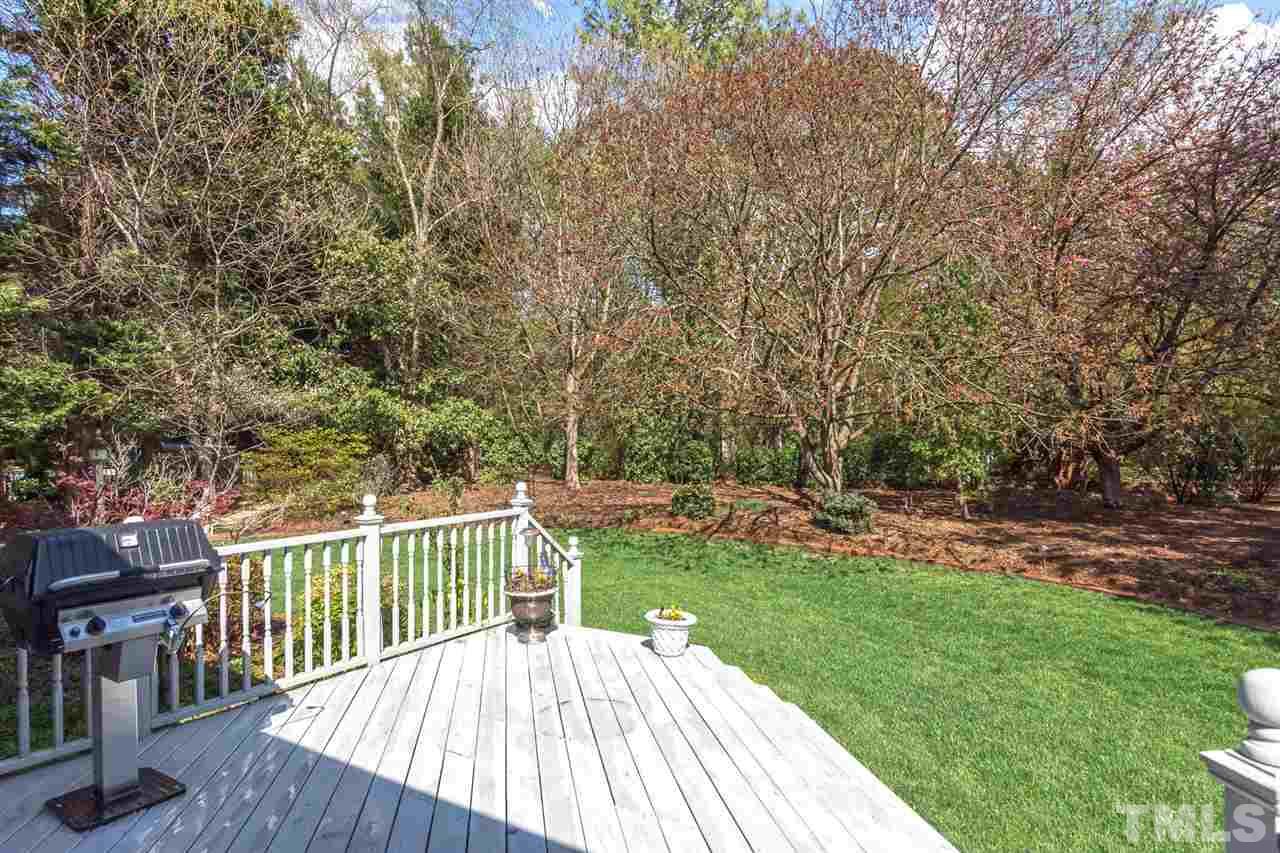 4012 John S Raboteau Wynd Raleigh, NC 27612 - Photo 22 of 25 a view of a deck with a yard