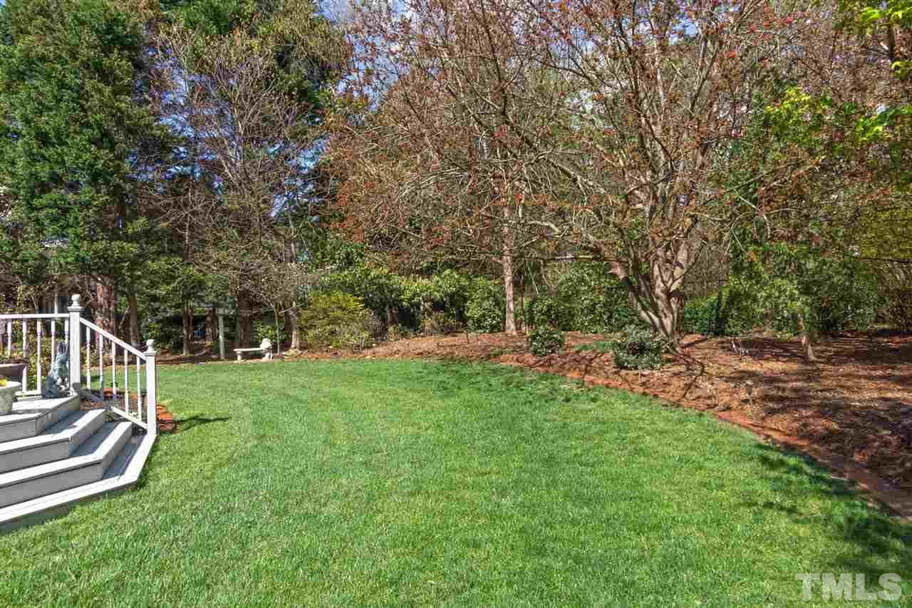 4012 John S Raboteau Wynd Raleigh, NC 27612 - Photo 23 of 25 a view of a house with backyard and sitting area
