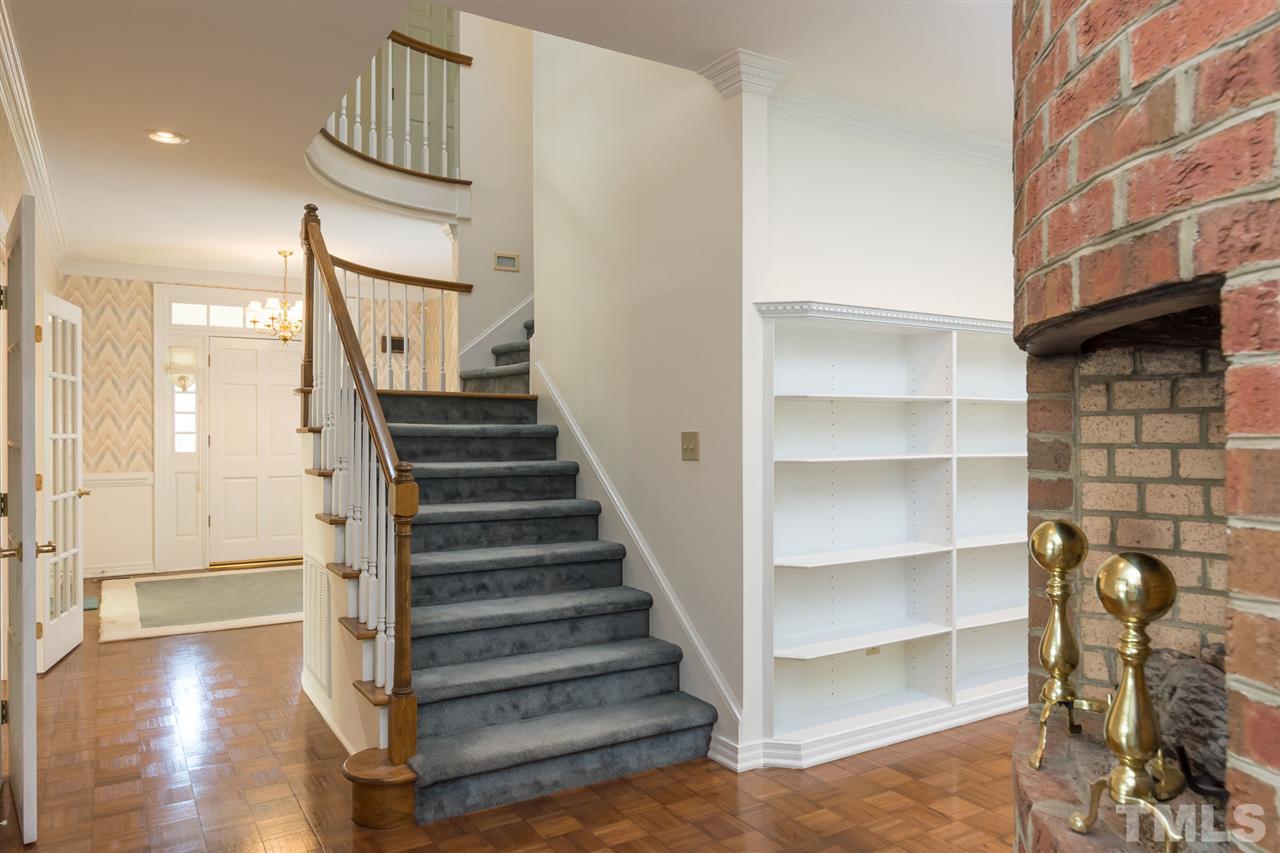 4012 John S Raboteau Wynd Raleigh, NC 27612 - Photo 6 of 25 a view of a livingroom with wooden floor and staircase