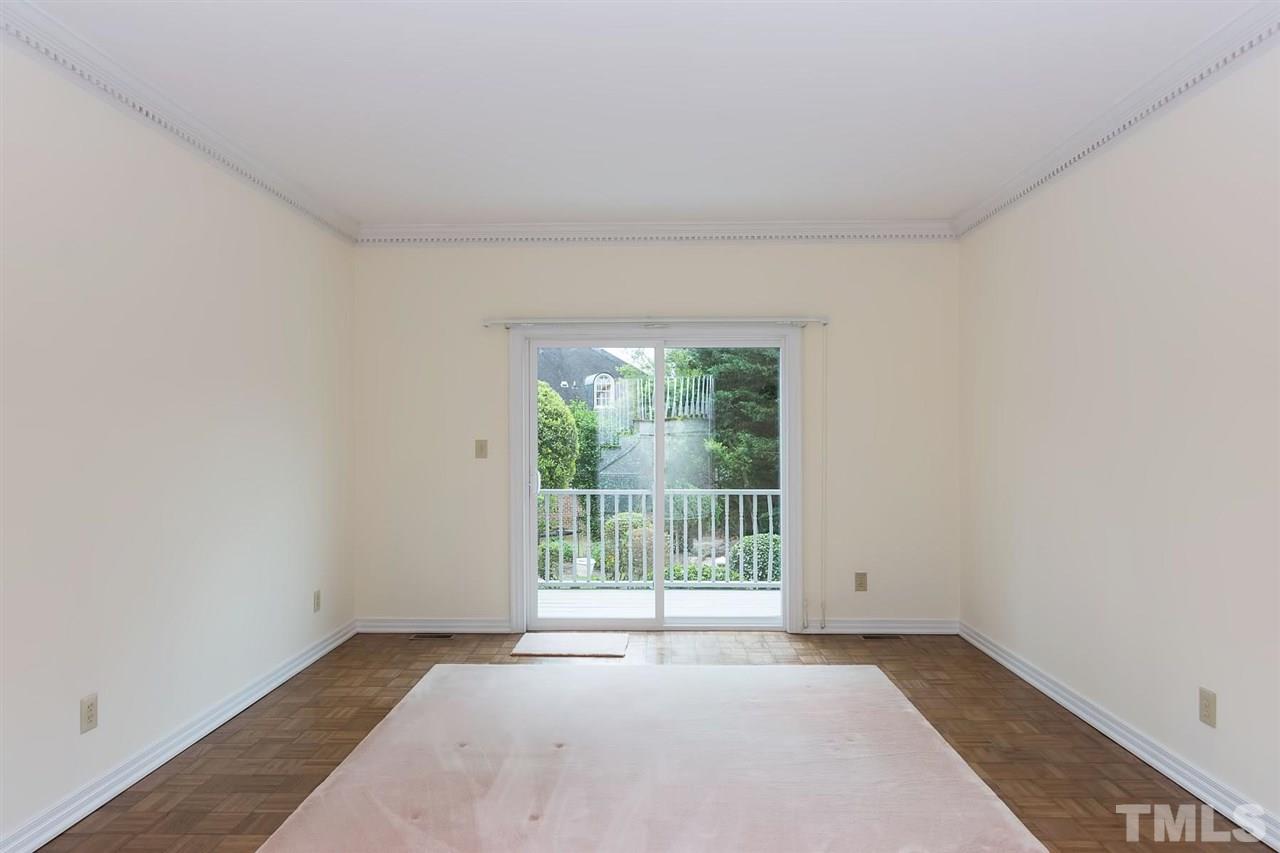 4012 John S Raboteau Wynd Raleigh, NC 27612 - Photo 8 of 25 an empty room with wooden floor and windows