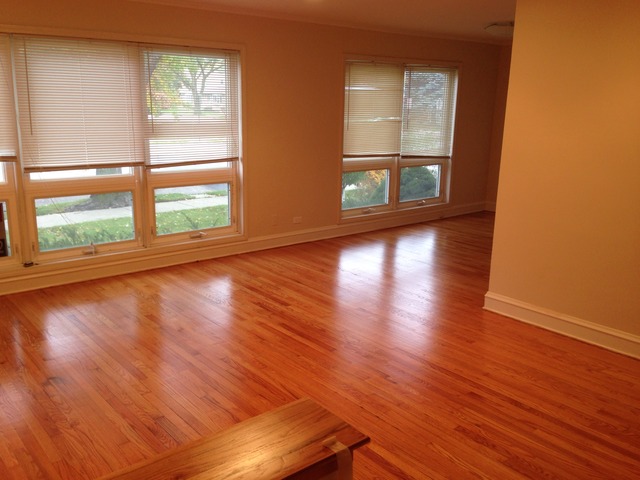3552 Main Street Skokie, IL 60076 - Photo 2 of 8 an empty room with wooden floor and windows