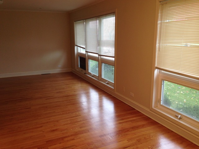 3552 Main Street Skokie, IL 60076 - Photo 3 of 8 a view of a room with wooden floor and windows