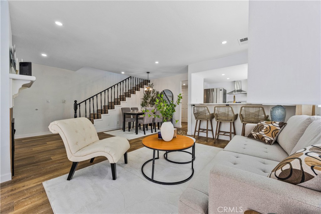 1126 West 228th Street, Unit 16 Torrance, CA 90502 - Photo 1 of 32 a living room with furniture a rug and white walls