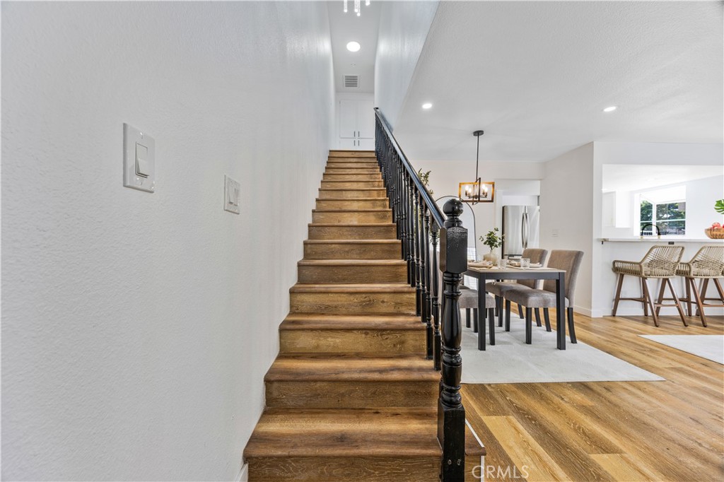 1126 West 228th Street, Unit 16 Torrance, CA 90502 - Photo 11 of 32 a view of entryway and hall with wooden floor