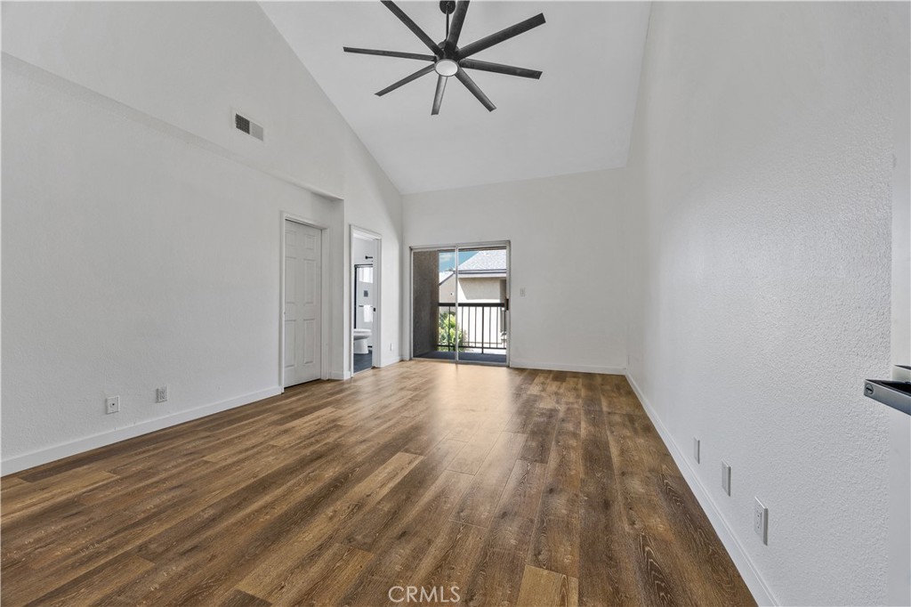 1126 West 228th Street, Unit 16 Torrance, CA 90502 - Photo 18 of 32 a view of empty room with wooden floor and fan