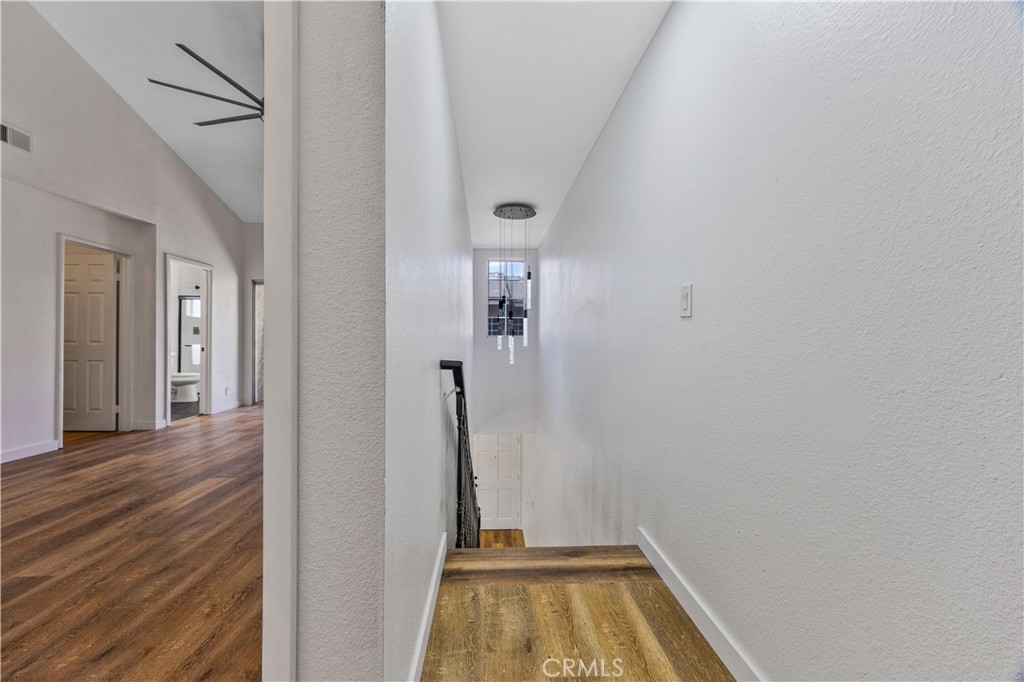 1126 West 228th Street, Unit 16 Torrance, CA 90502 - Photo 20 of 32 a view of a hallway view with wooden floor and staircase