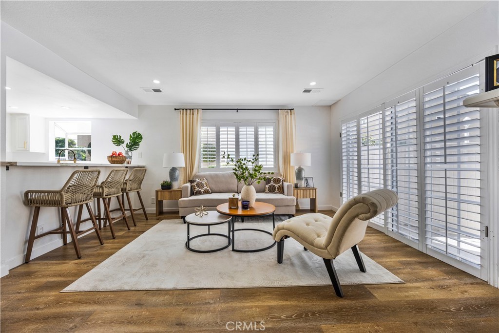 1126 West 228th Street, Unit 16 Torrance, CA 90502 - Photo 2 of 32 a living room with furniture and a potted plant