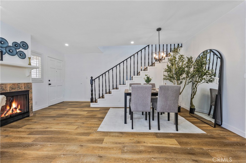 1126 West 228th Street, Unit 16 Torrance, CA 90502 - Photo 5 of 32 a view of dining room and hall with wooden floor