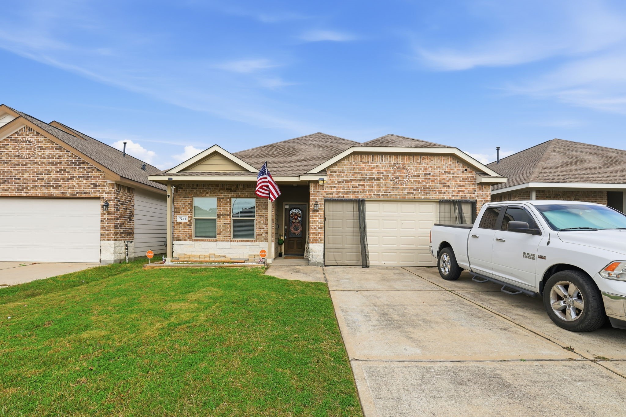 7243 Foxtail Meadow Humble, TX 77338 - Photo 1 of 13 a front view of a house with a garden and parking space