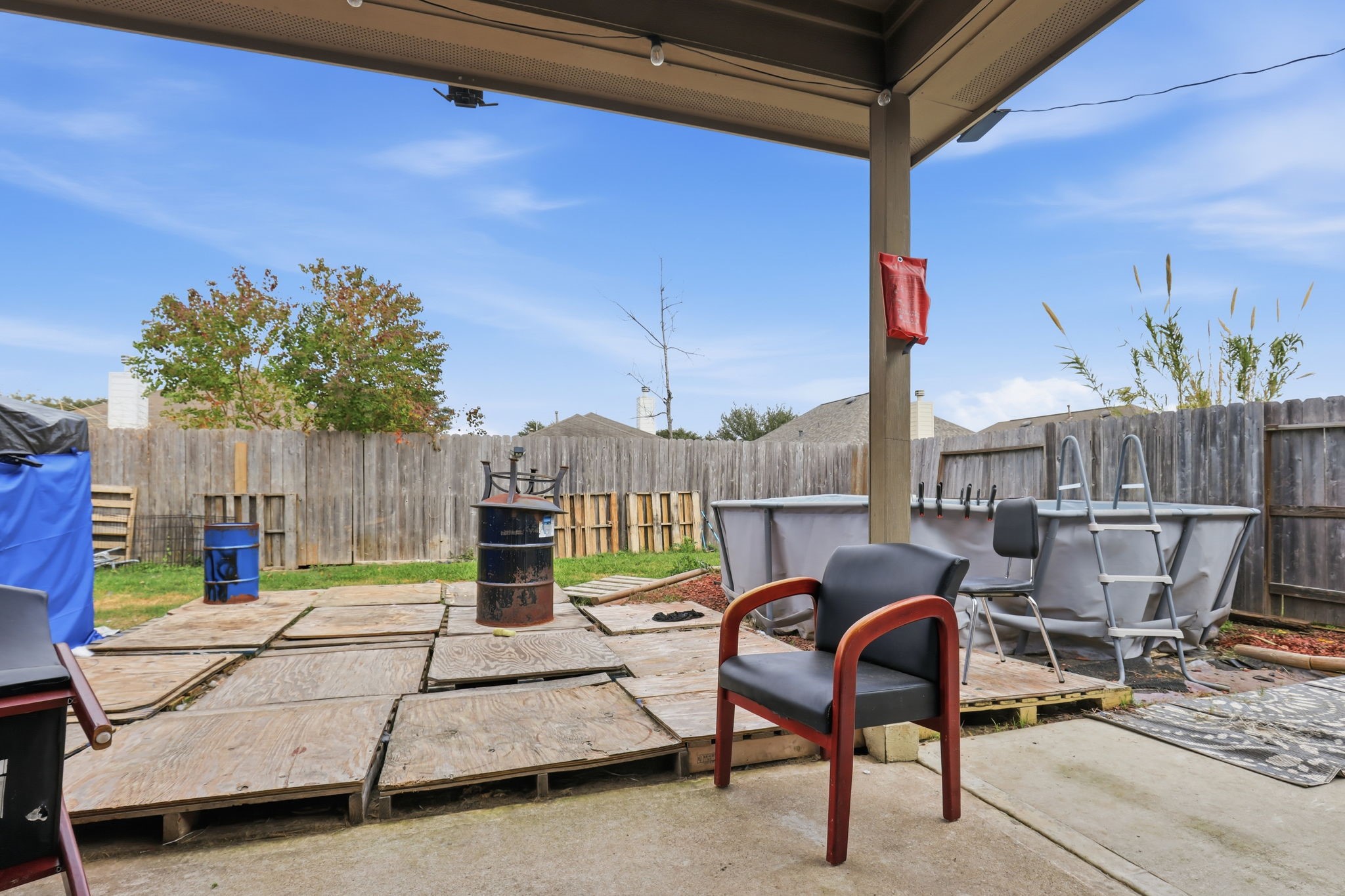 7243 Foxtail Meadow Humble, TX 77338 - Photo 12 of 13 a view of a patio with table and chairs potted plants with wooden fence