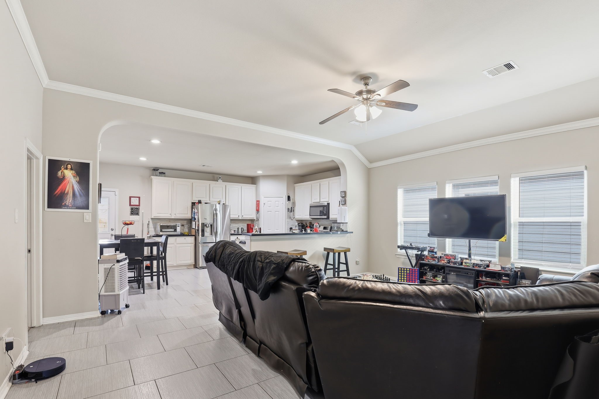 7243 Foxtail Meadow Humble, TX 77338 - Photo 2 of 13 a living room with furniture and a flat screen tv