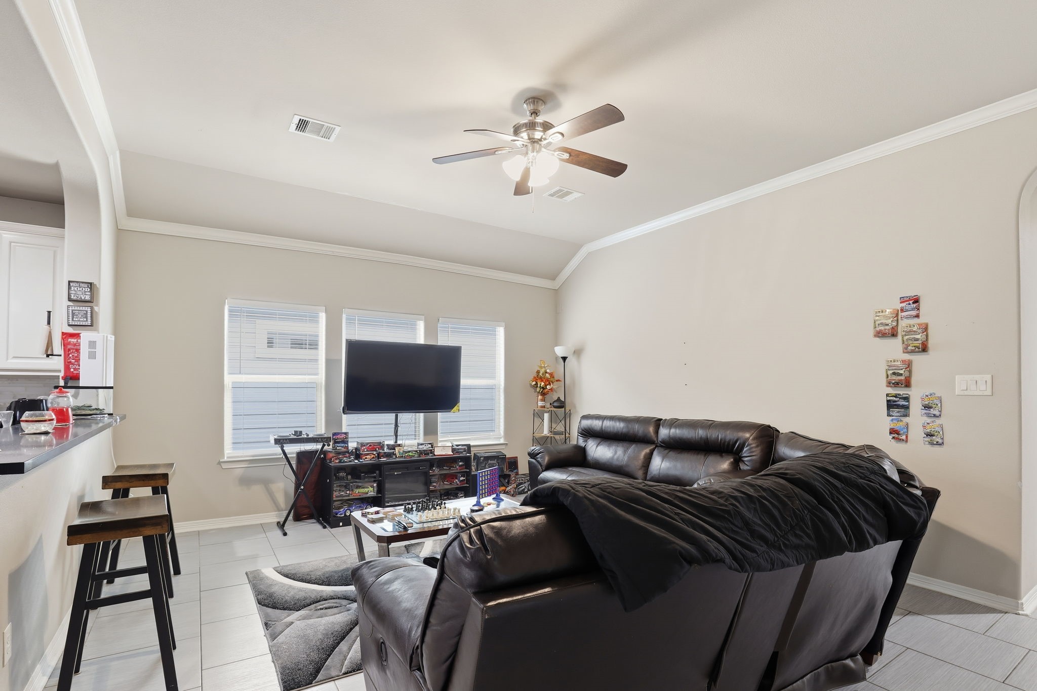 7243 Foxtail Meadow Humble, TX 77338 - Photo 3 of 13 a bedroom with a bed and a chandelier