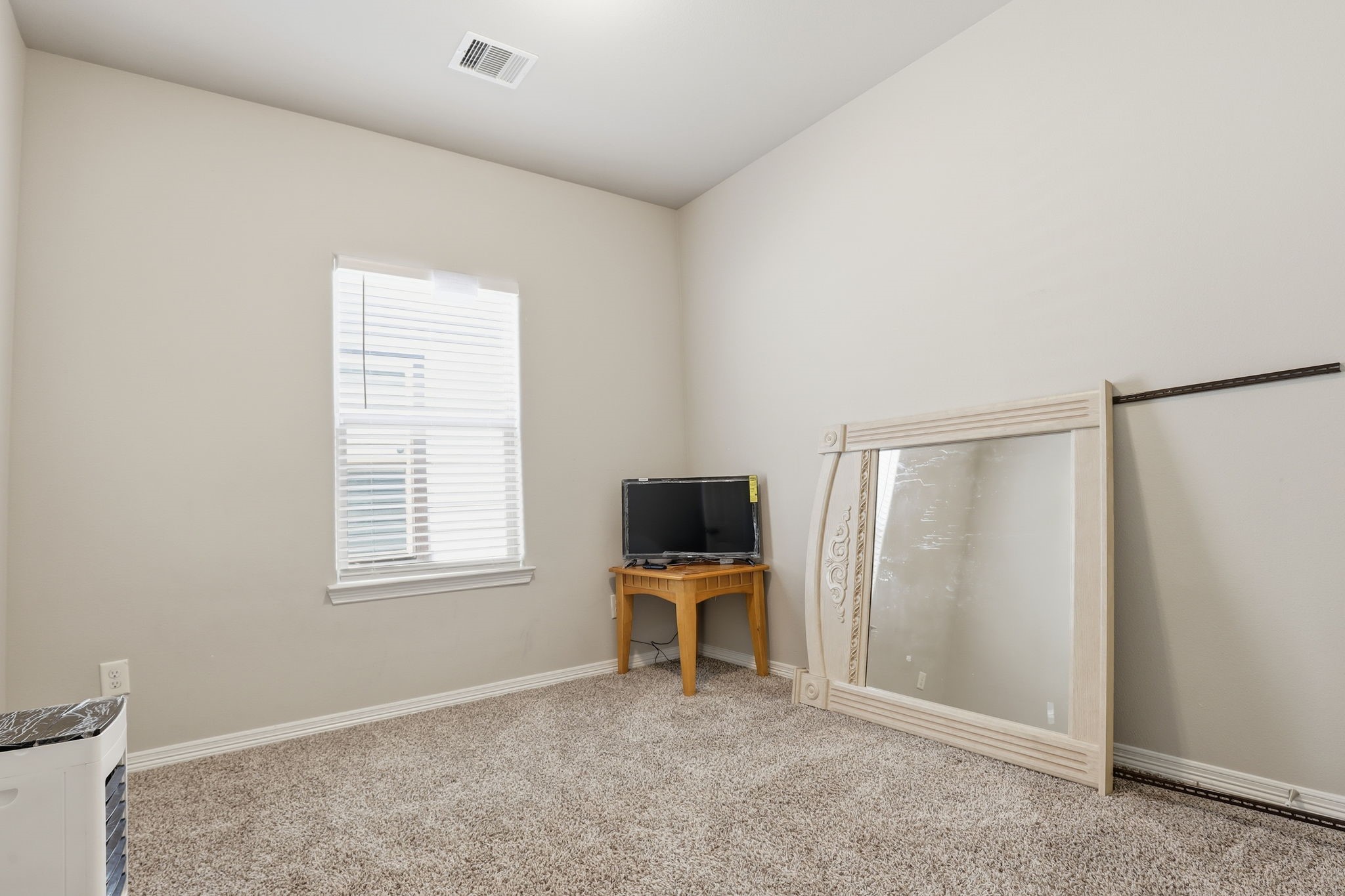 7243 Foxtail Meadow Humble, TX 77338 - Photo 8 of 13 a view of a room with a flat screen tv and windows
