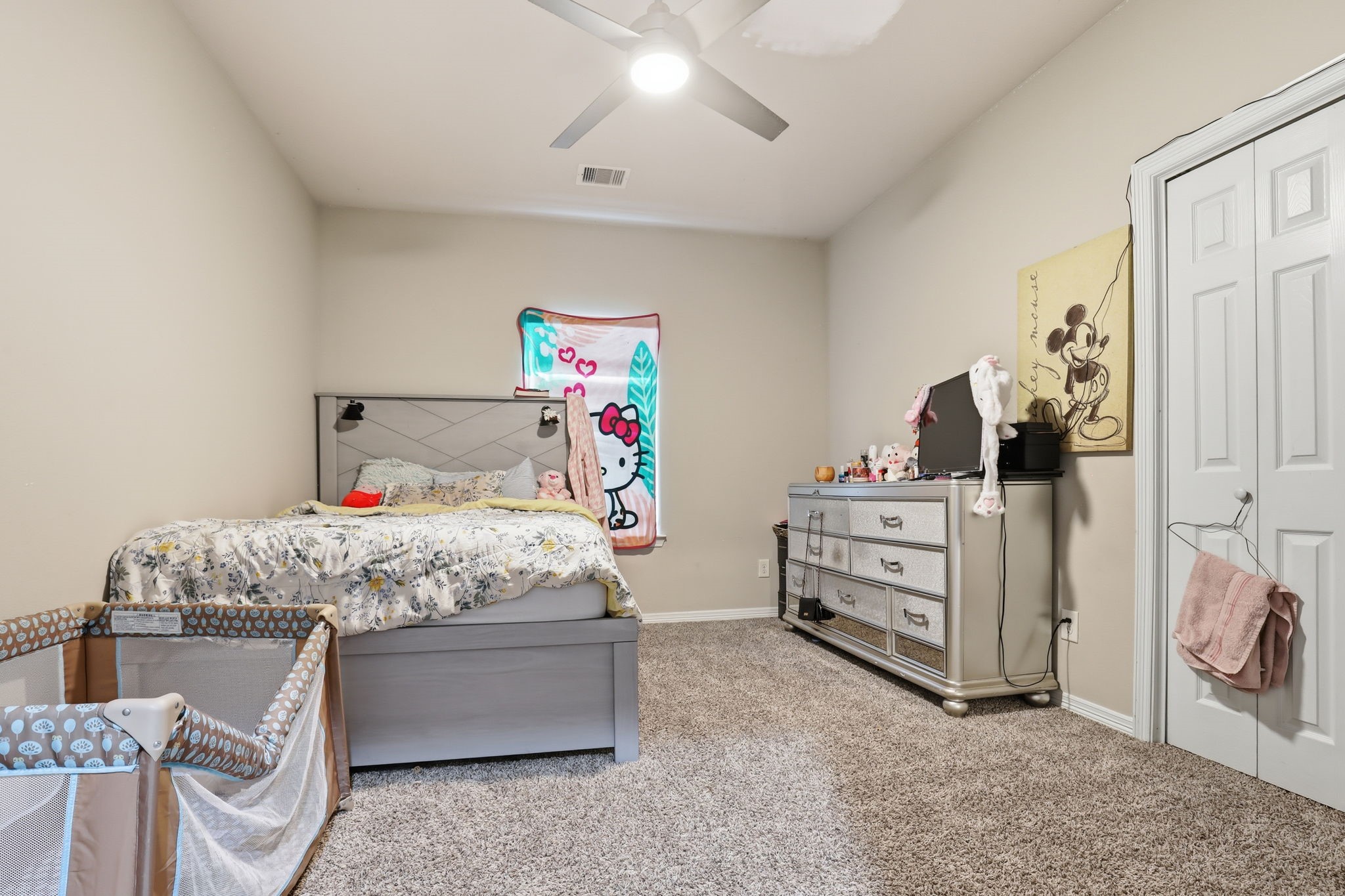 7243 Foxtail Meadow Humble, TX 77338 - Photo 9 of 13 a bedroom with a bed and a cabinets