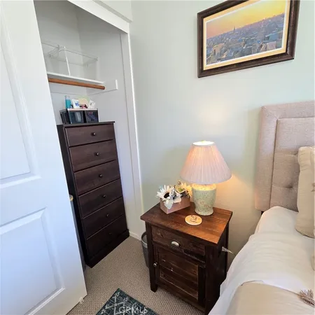 a kitchen with stainless steel appliances granite countertop table chairs refrigerator and microwave